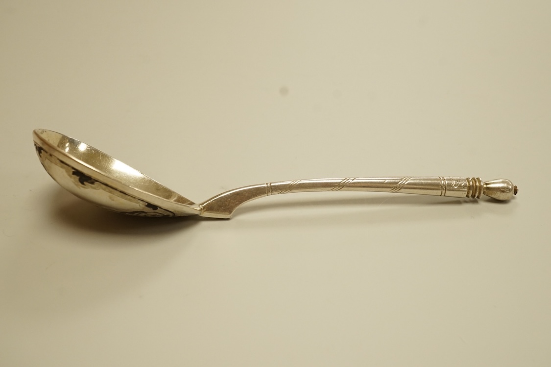 A mid 19th century Russian 84 zolotnik and niello spoon, assay master probably I. Avdyeyev, Moscow, 1857, 18cm.